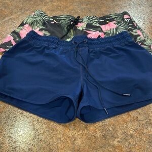 Two pair of swim shorts size, extra large, and size 12